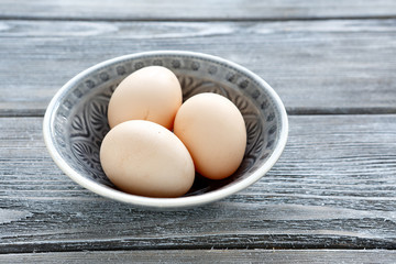 Eggs in a bowl on the boards
