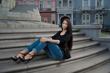 Fototapeta na wymiar woman sitting on the stairs