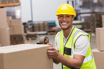Worker preparing goods for dispatch