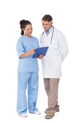 Doctor and nurse looking at clipboard