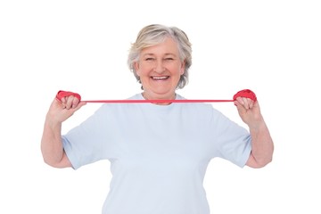 Senior woman using resistance band