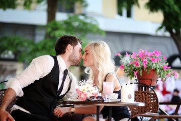 Couple sitting at a table in a cafe