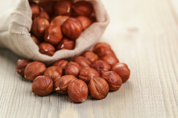 sack bag full of hazelnut kernels, rustic style photo
