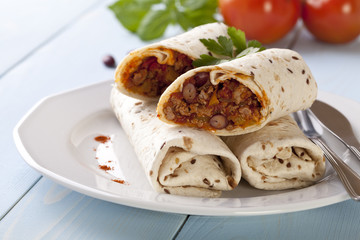 burritos wraps with meat beans and vegetables
