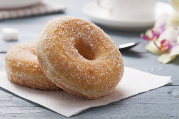 Fresh donut served with a cup of coffee