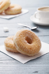 Fresh donut served with a cup of coffee
