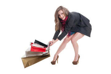 Fototapeta premium Happy shopping lady dragging heavy bags