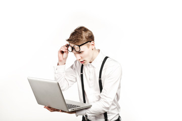 young man in glasses with laptop with emotion