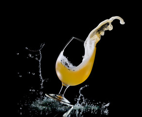 Falling glass of beer