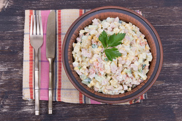 Russian traditional salad olivier with pea