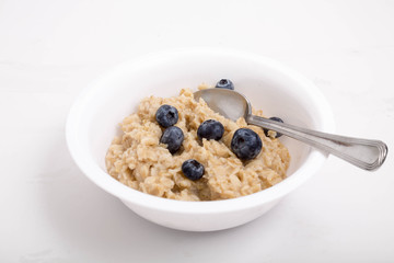 Oatmeal with Blueberries and Spoon in Bowl