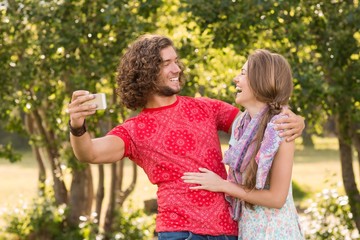 Obraz premium Friends taking a selfie in the park