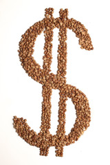 dollar sign made of buckwheat on  white background