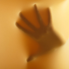 Fototapeta premium abstract hands, human arm inside yellow fabric, studio shot