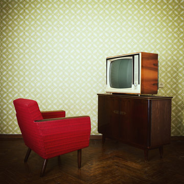 Vintage room with two old fashioned armchair and retro tvover ob