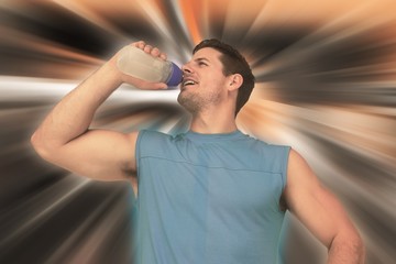 Composite image of smiling young man drinking water