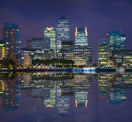Canary Wharf night view with reflection in Thames river