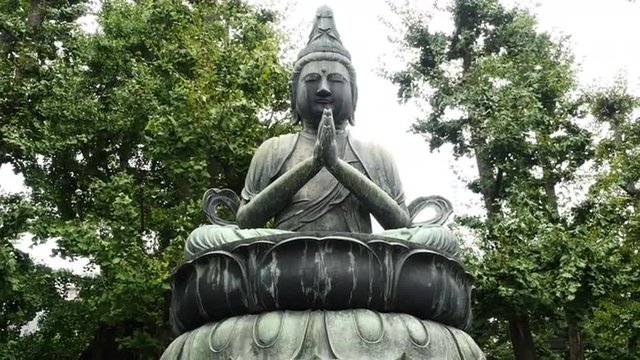 Zoom Out of Statue of Buddha at Sensoji Temple  -  Tokyo Japan 