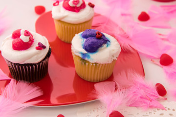 Valentines Day decorations and cupcakes with heart shaped frosti