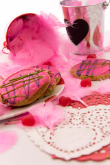 Obraz na płótnie Canvas Valentines Day - decorations and cookies with pink frosting and