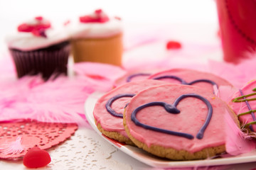 Valentines Day - pink cookies and cupcakes with hearts