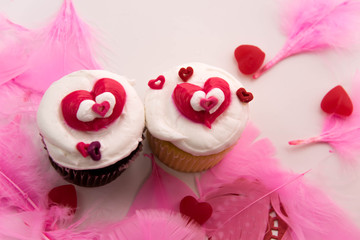 Valentines Day decorations and cupcakes with heart shaped frosti