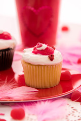Valentines Day decorations and cupcakes with heart shaped frosti