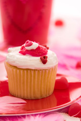 Valentines Day decorations and cupcakes with heart shaped frosti