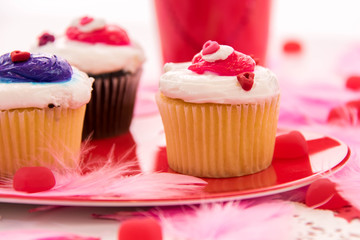 Valentines Day decorations and cupcakes with heart shaped frosti