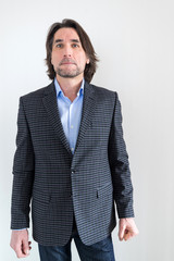 man in a checkered jacket on  light background