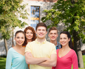 group of smiling teenagers over campus background