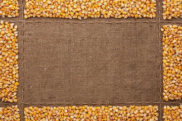 Beautiful frame with corn on sackcloth