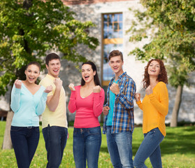 group of smiling teenagers over campus background