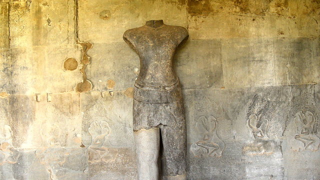 Zoom out - Stone Carving of Buddha Body on Temple Wall  - Angkor Wat, Cambodia