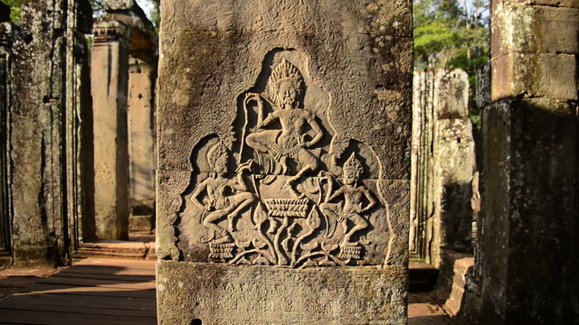 Zoom out-  Stone Carving of Religious Icons on Temple Wall - Angkor Wat, Cambodia