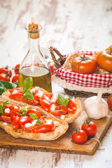 Italian starter, bruschetta with Sicilian red fresh tomato and m