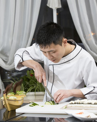 Fototapeta na wymiar Japanese chef preparing a meal in a restaurant