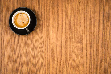 Black Coffee in Black Ceramic Cup on Wooden Table
