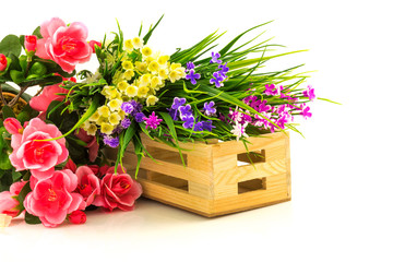 Obraz na płótnie Canvas Flowers in wooden basket