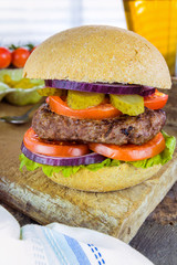 Homemade beef burger and a glass of beer