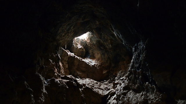 Light Rays Shine inside of Lava Tube Cave