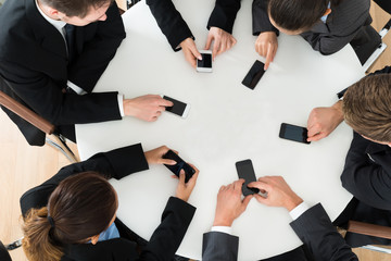 Businesspeople Using Cell Phone