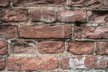 Destroyed the old red brick wall, close up view