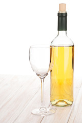 White wine glass and bottle
