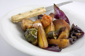 baked vegetable dish on white background