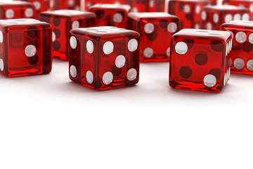 Many red dice with selective focus over white background