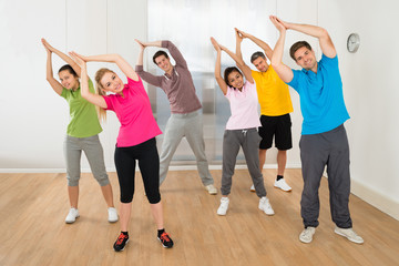 Group Of People Practicing Yoga