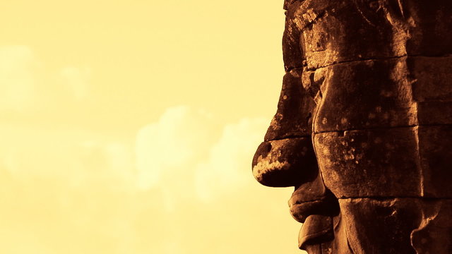 Zoom Out of Stone Carving of Buddha's Face on Temple Wall - Angkor Wat Temple Cambodia