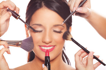Young woman getting professional beauty and makeup treatment