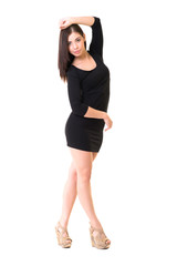 young beautiful dancer posing on a studio background